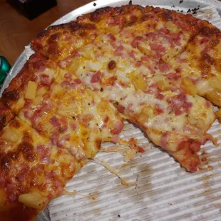 Ham and pineapple with extra cheese on top.
