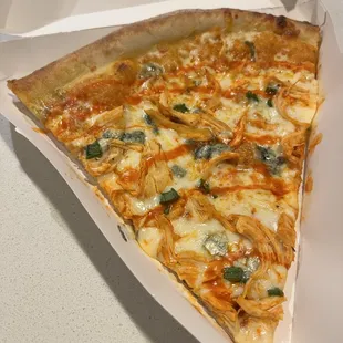Specialty Slice, with buffalo chicken, buffalo ranch sauce, and blue cheese crumbles