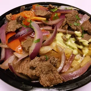 a plate of meat and vegetables