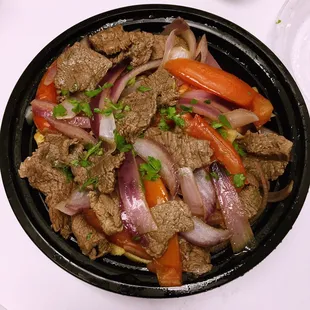 beef, carrots, and onions in a bowl