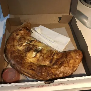Massive Regular Calzone, look @ plasticware and napkin for size scale.