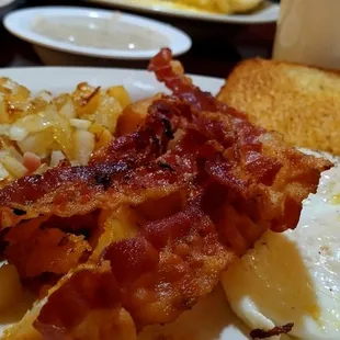 Bacon, toast &amp; gravy, home fries with onion, eggs over medium