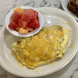 ABC omelet (avocado, bacon, cheese) with side of fruit and toast included. You can also choose from hash browns or fries.