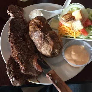 Steak special with baked potato and side salad