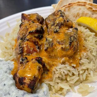 My go to dish! Chicken Slovaki sauced over rice pilaf, and hummus from Mikonos Grill