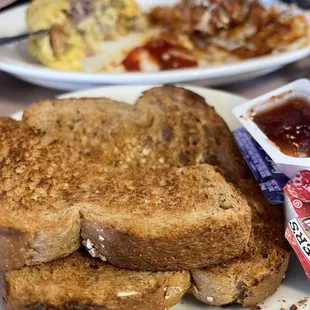 a plate of food with a sandwich and a cup of coffee