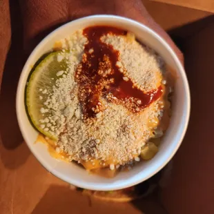 a person holding a bowl of food