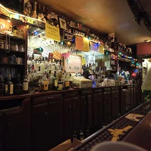 a woman standing at the bar