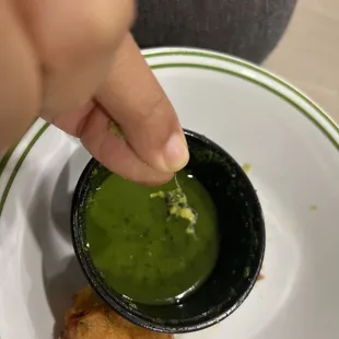 A metal piece in sauce