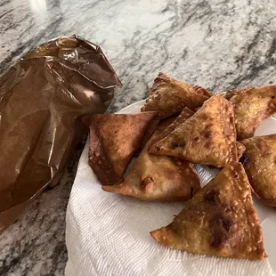 a plate of pastries and a bag of chocolate