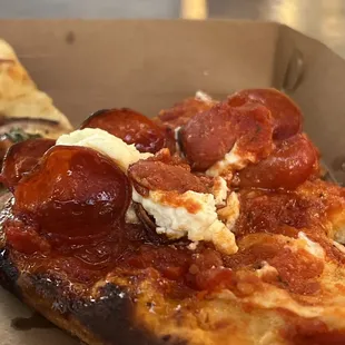 a slice of pepperoni pizza