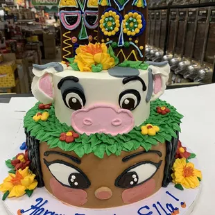 a birthday cake with a cow on top
