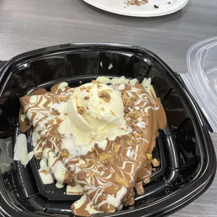a plate of ice cream on a waffle
