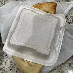 two slices of bread in a plastic container