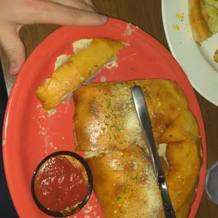Meat lovers calzone (knife for reference. - they are huge!)