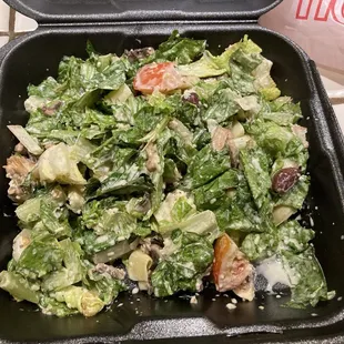 Salad saturated with bland dressing
