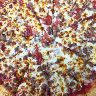 a pizza with sausage and cheese