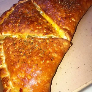 Our infamous and underrated calzone! Cheesy goodness!