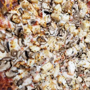 a pizza with mushrooms and cheese