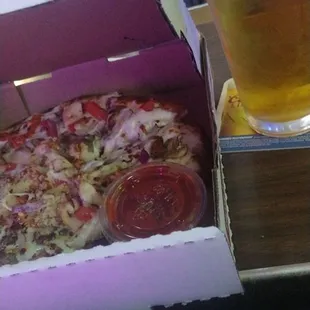 Mayo slathered cold pizza snuggled up to a good beer