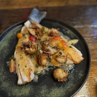 Branzino w fried artichoke and tomatoes