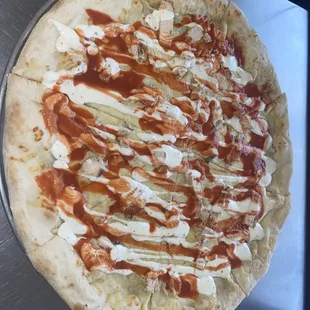 a pizza covered in sauce