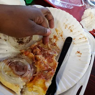 Cheese pizza slice, see where my finger points into the sludgy dough.