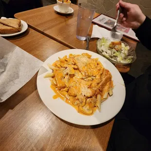 a plate of pasta and salad
