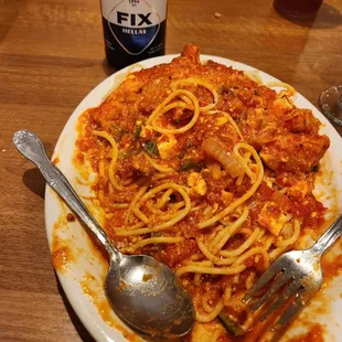 Chicken Santorini with spaghetti and a Greek lager.