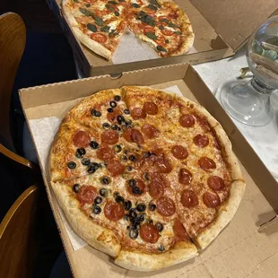 Magnetita Pizza and half pepperoni, half pepperoni and black olives pizza. $10 each.