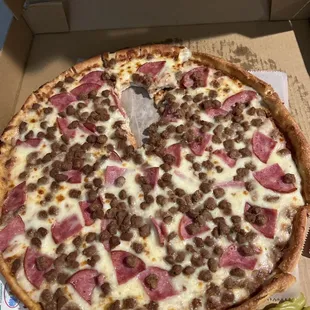 Canadian bacon sausage pizza, regular crust.