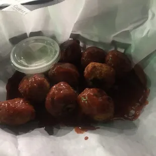 a basket of meatballs with sauce