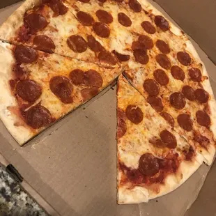 a pepperoni pizza in a box