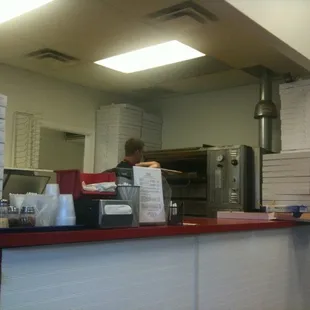 a man standing at a counter