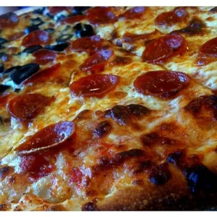 a pepperoni and olive pizza