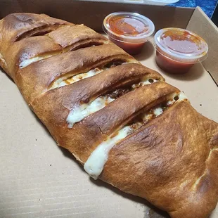 Ground Beef, Sausage, Onions, Peppers, Mushrooms and Cheese Stromboli