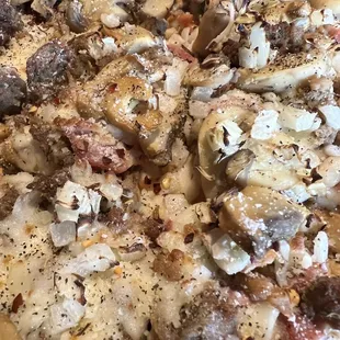 Italian meats pizza add shrooms and onions