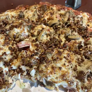 Italian Meat pizza with onion and mushroom added.