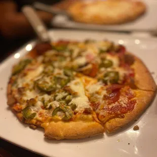 Pepperoni sausage pineapple jalapeño then crust