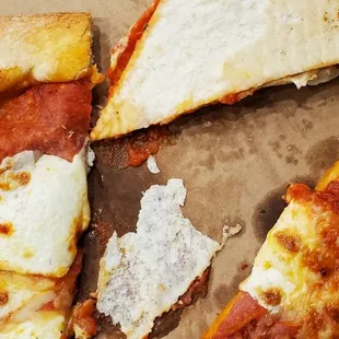 Left over pizza with uncooked dough