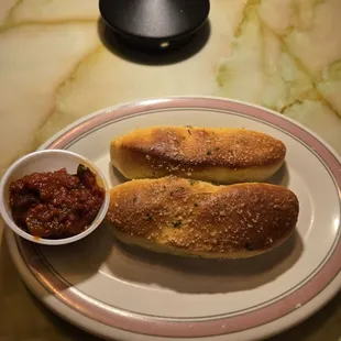 Warm fresh bread sticks with marinara sauce