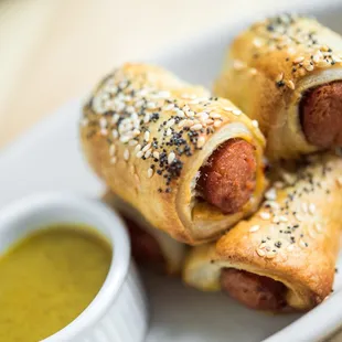 Our Hoyt Dogs in Blankets: All beef franks, served with maple mustard