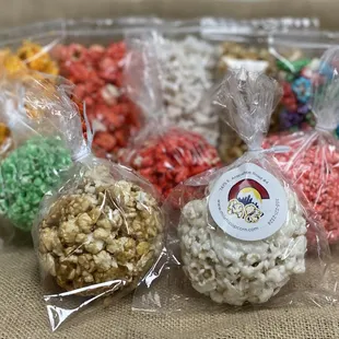 Need a snack? Try our treats! Snack bags filled with gourmet flavors, traditional popcorn balls, or popcorn bars mixed with candies.