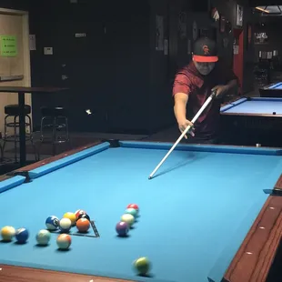 a man playing pool