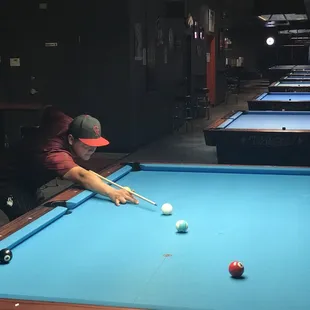 a man playing pool