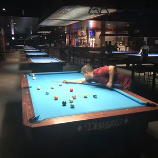 a man playing pool