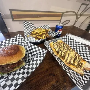 Cheese coma burger, chili cheese fries, and steak Philly