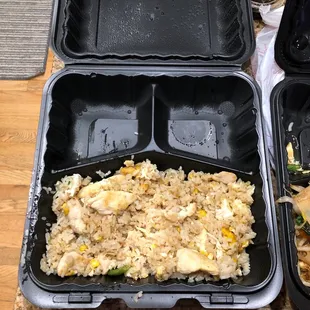 two takeout containers with rice and vegetables