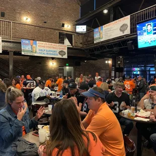 a large group of people sitting at tables