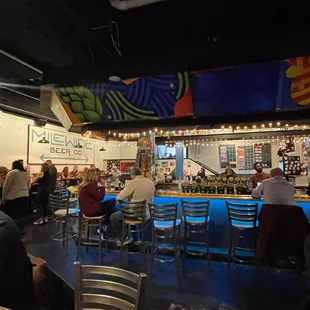 people sitting at the bar